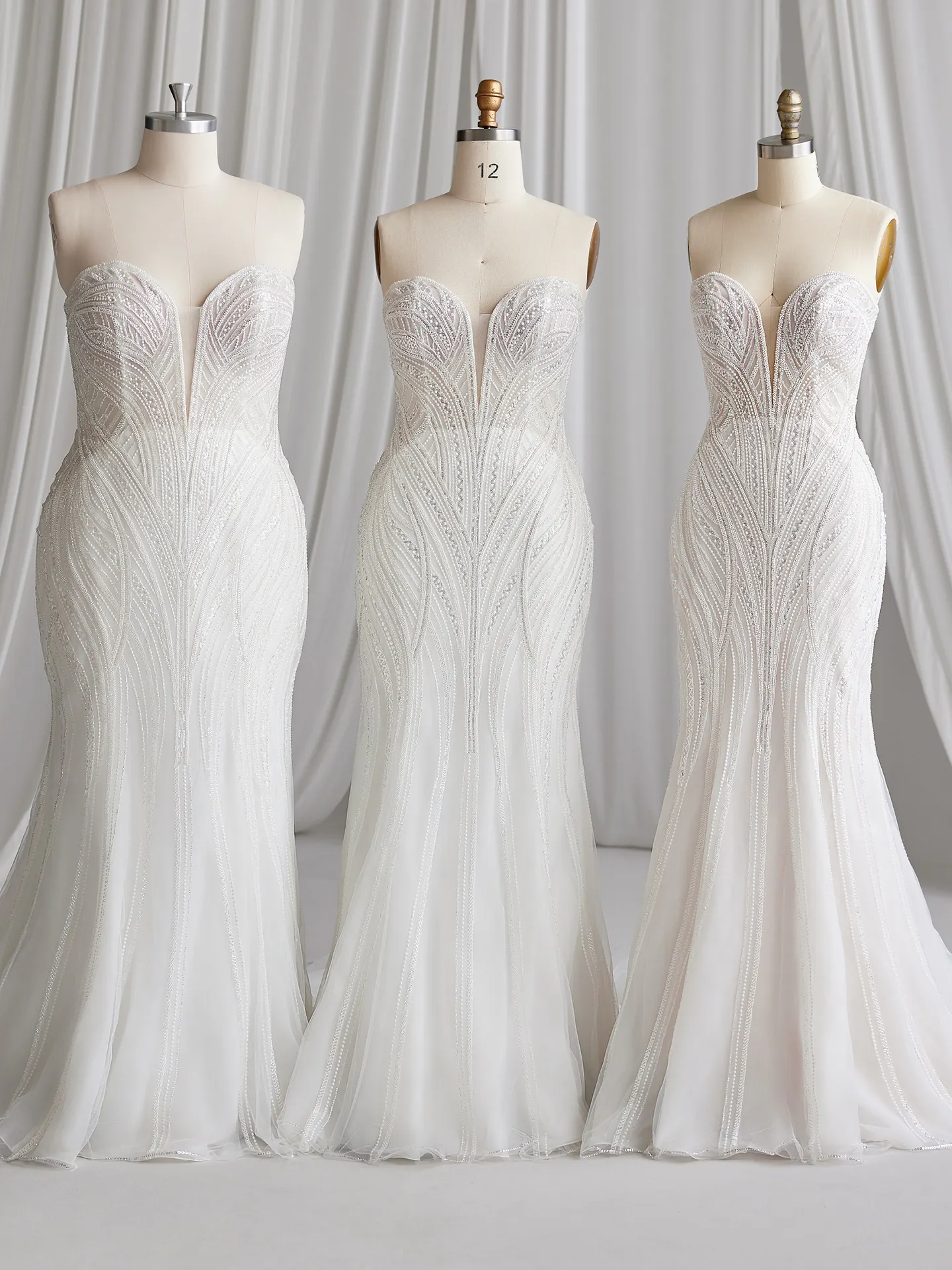 Sottero and Midgley Positano mermaid beaded gown on mannequins front view.