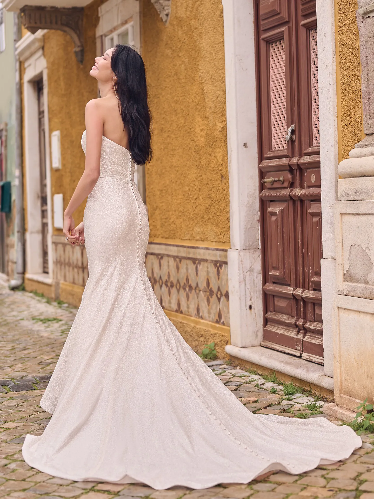 Maggie Sottero Anniston Lane back view glitter fit-and-flare bridal gown