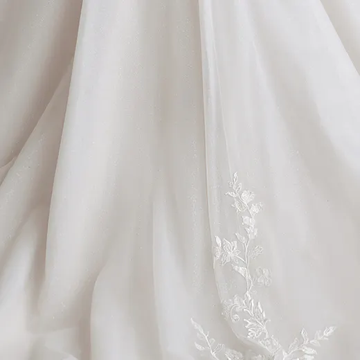 Rebecca Ingram Lizzy gown close-up of floral sequin design.