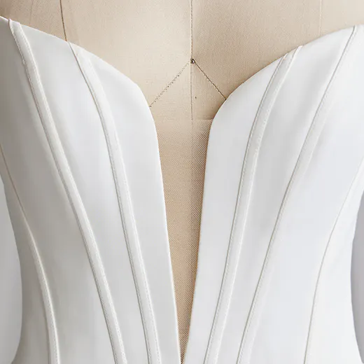 Maggie Sottero Derrick satin V-neckline bridal gown close-up