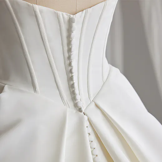 Maggie Sottero Derrick satin back view with buttons and pleats