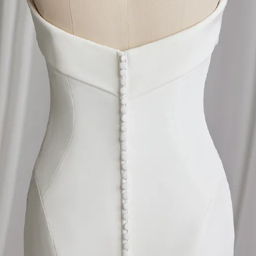 Rebecca Ingram Francine back view, straight neckline crepe bridal dress, button detail.