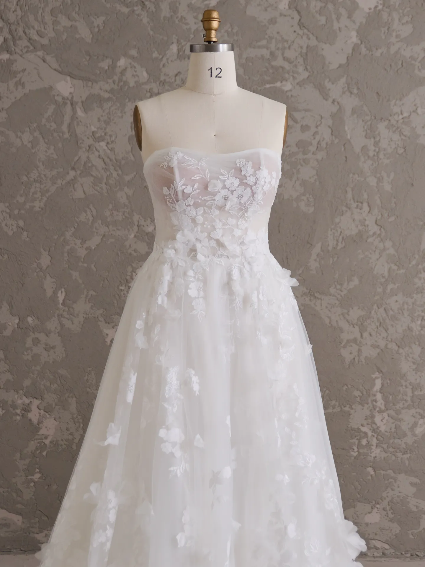 Maggie Sottero Laila front view 3D floral wedding gown on mannequin