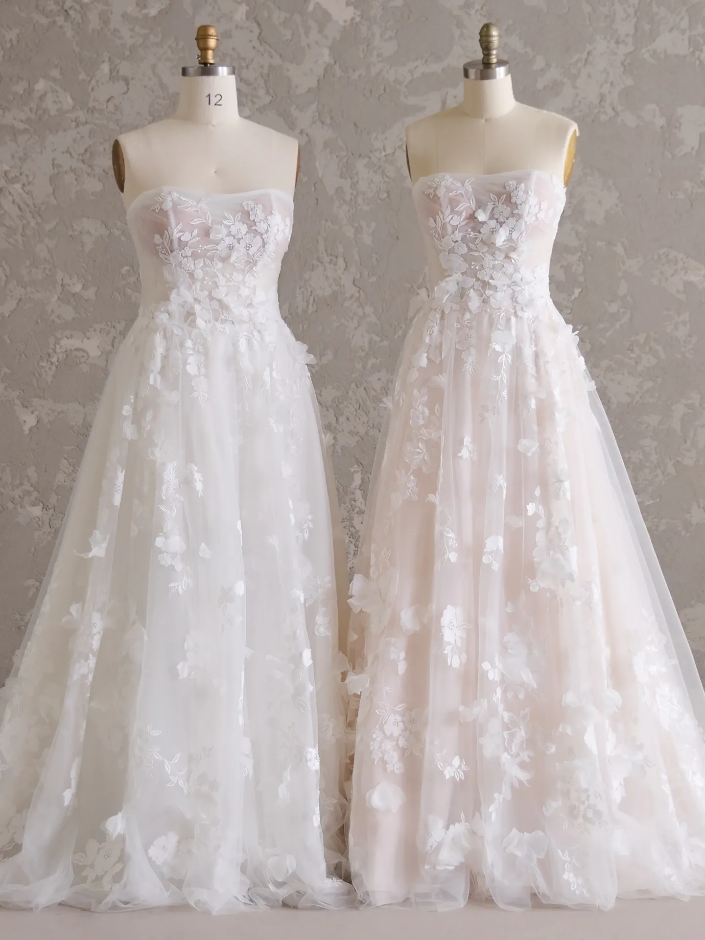 Maggie Sottero Laila 3D floral wedding gowns on mannequins front view