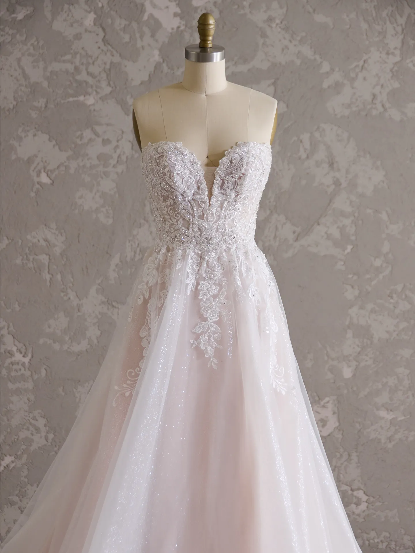 Maggie Sottero Marguerite A-Line gown front view with thigh-high slit detail.