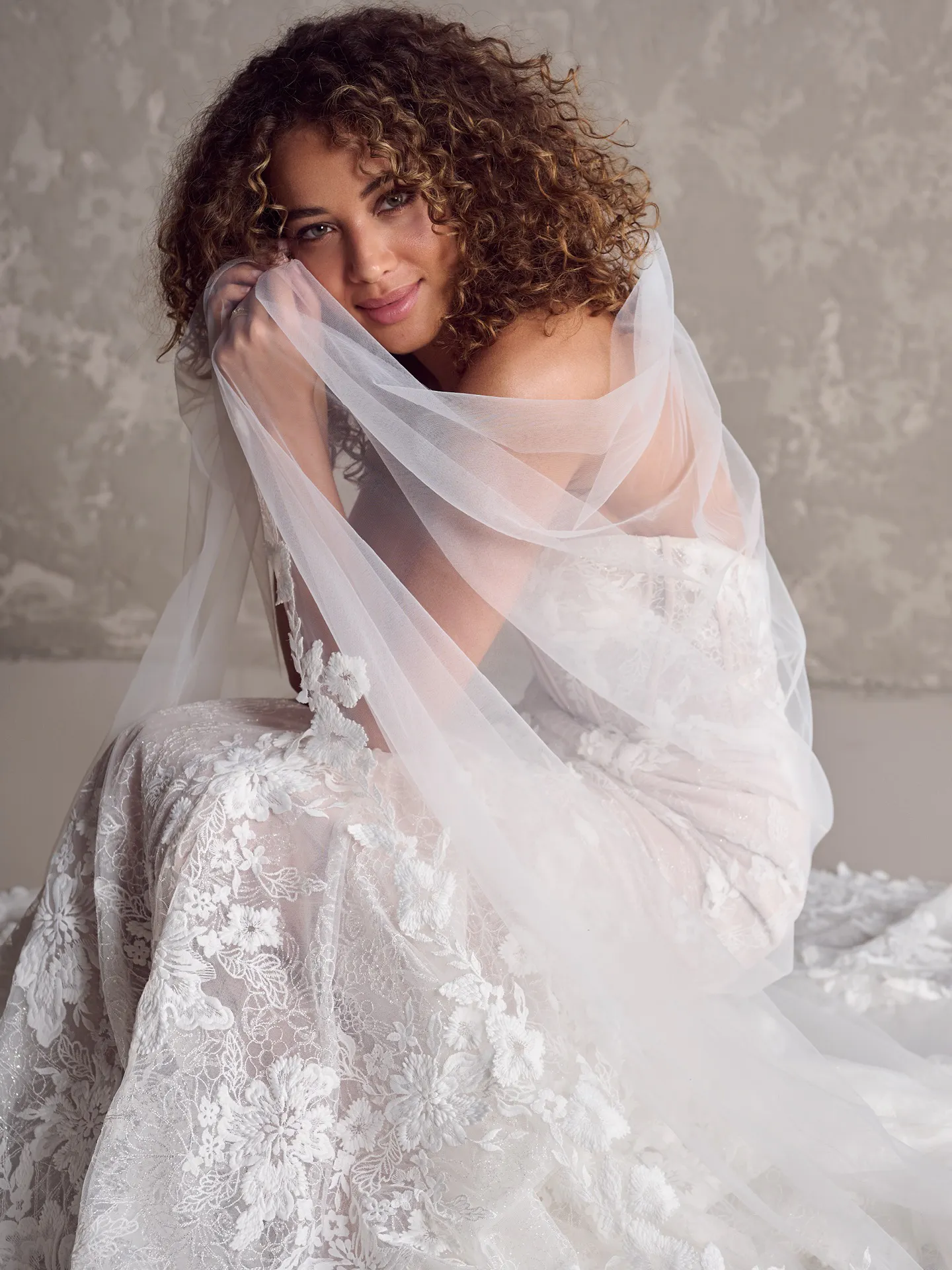 Maggie Sottero Ortensia lace bridal dress side view with veil