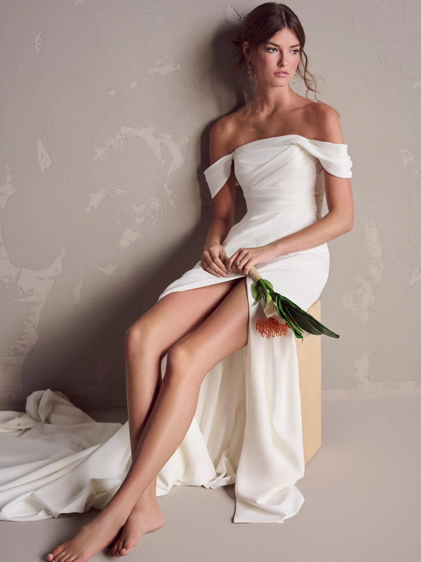 Maggie Sottero Summer front view crepe wedding dress with off-shoulder design