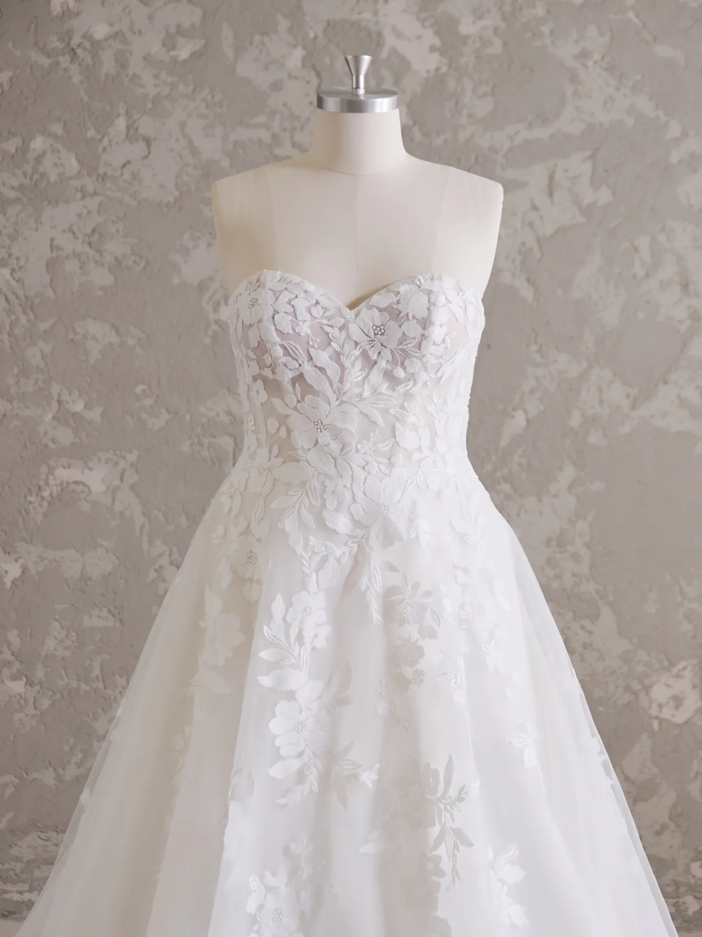 Rebecca Ingram Ruby front view A-line wedding dress with sweetheart neckline and floral lace.