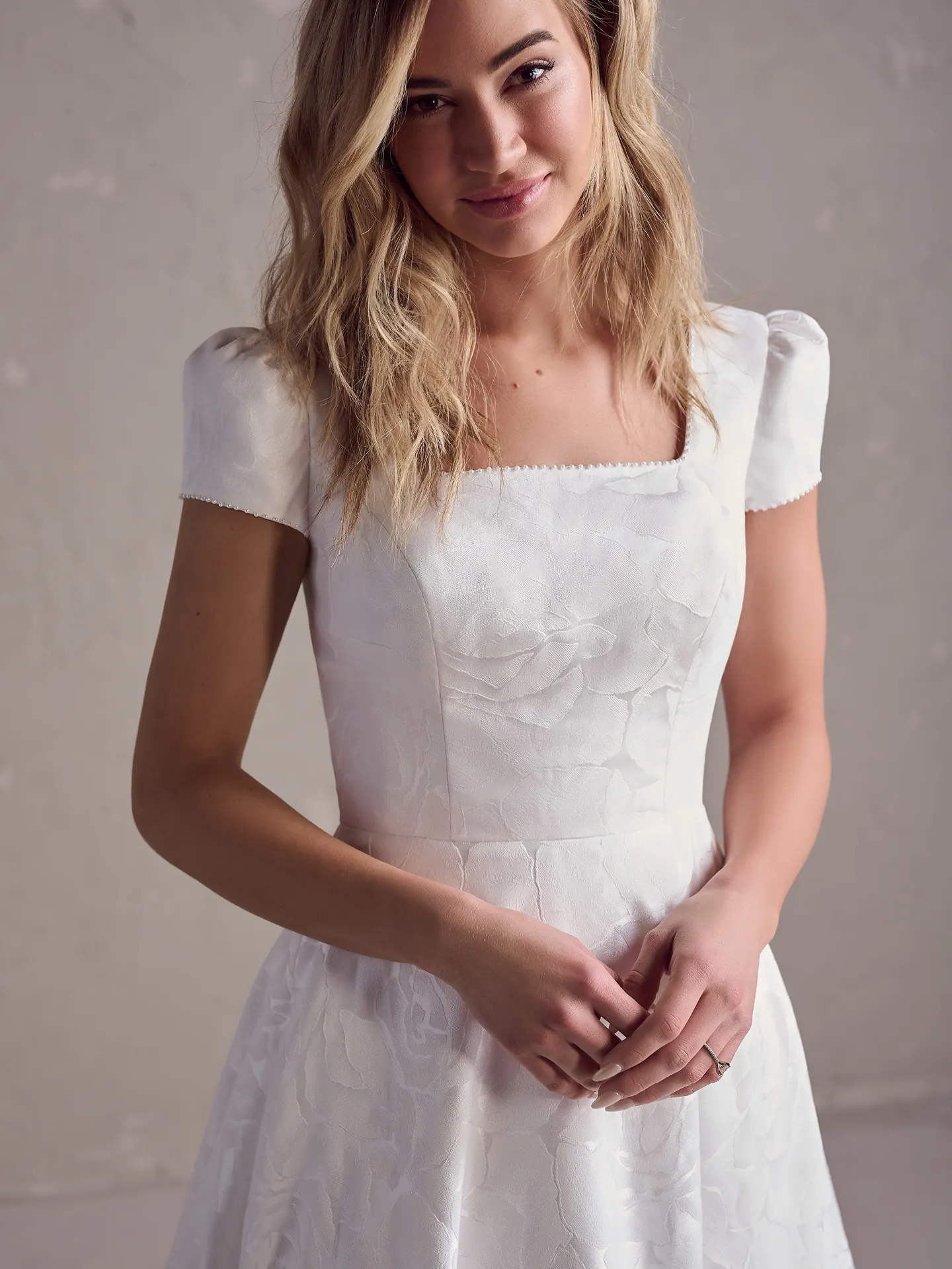 Rebecca Ingram Vesta Leigh front view, short sleeves, textured floral pattern