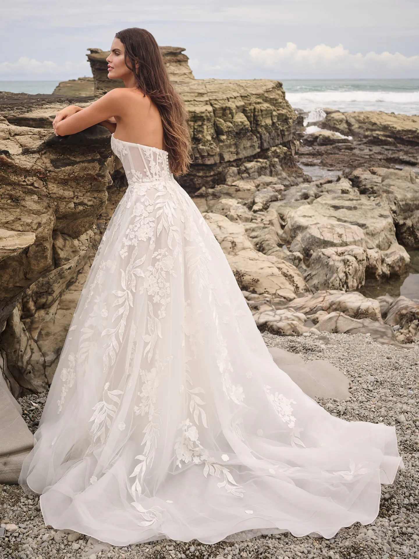 Sottero and Midgley Destin A-Line gown back view on rocky shore