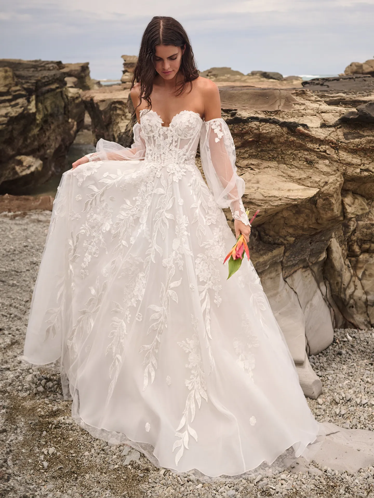 Sottero and Midgley Destin A-Line front view on rocky beach