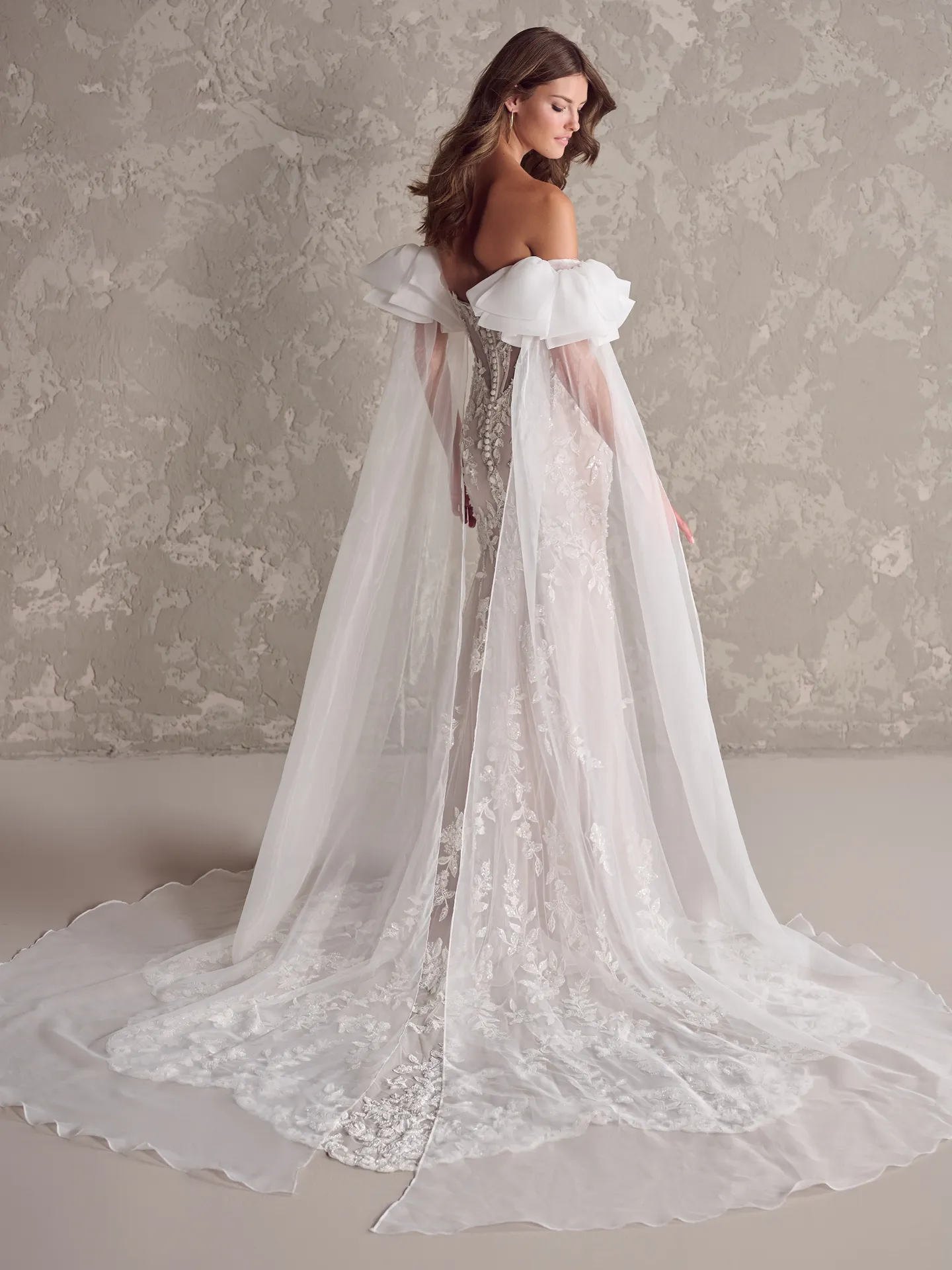 Sottero and Midgley Tanica back view gown with flowing train and sweetheart neckline.