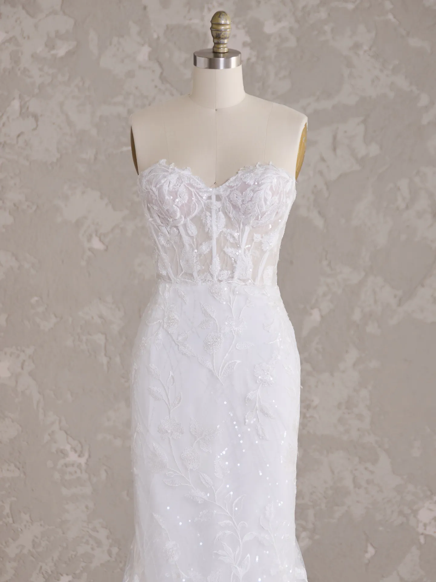 Maggie Sottero Fairchild top view, lace sequin bridal gown on mannequin