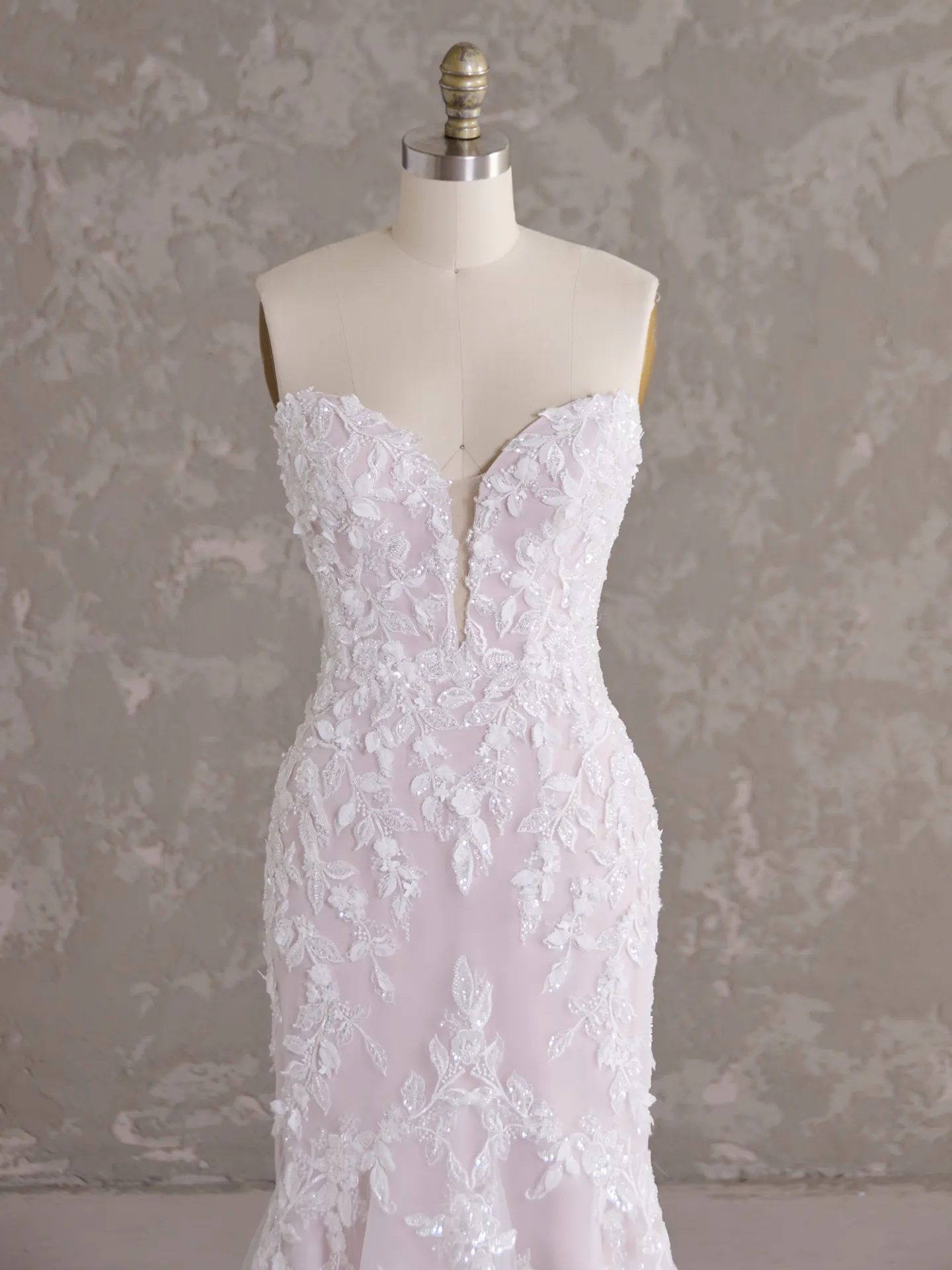 Sottero and Midgley Tanica dress on mannequin, sweetheart neckline, lace detail, close front view.