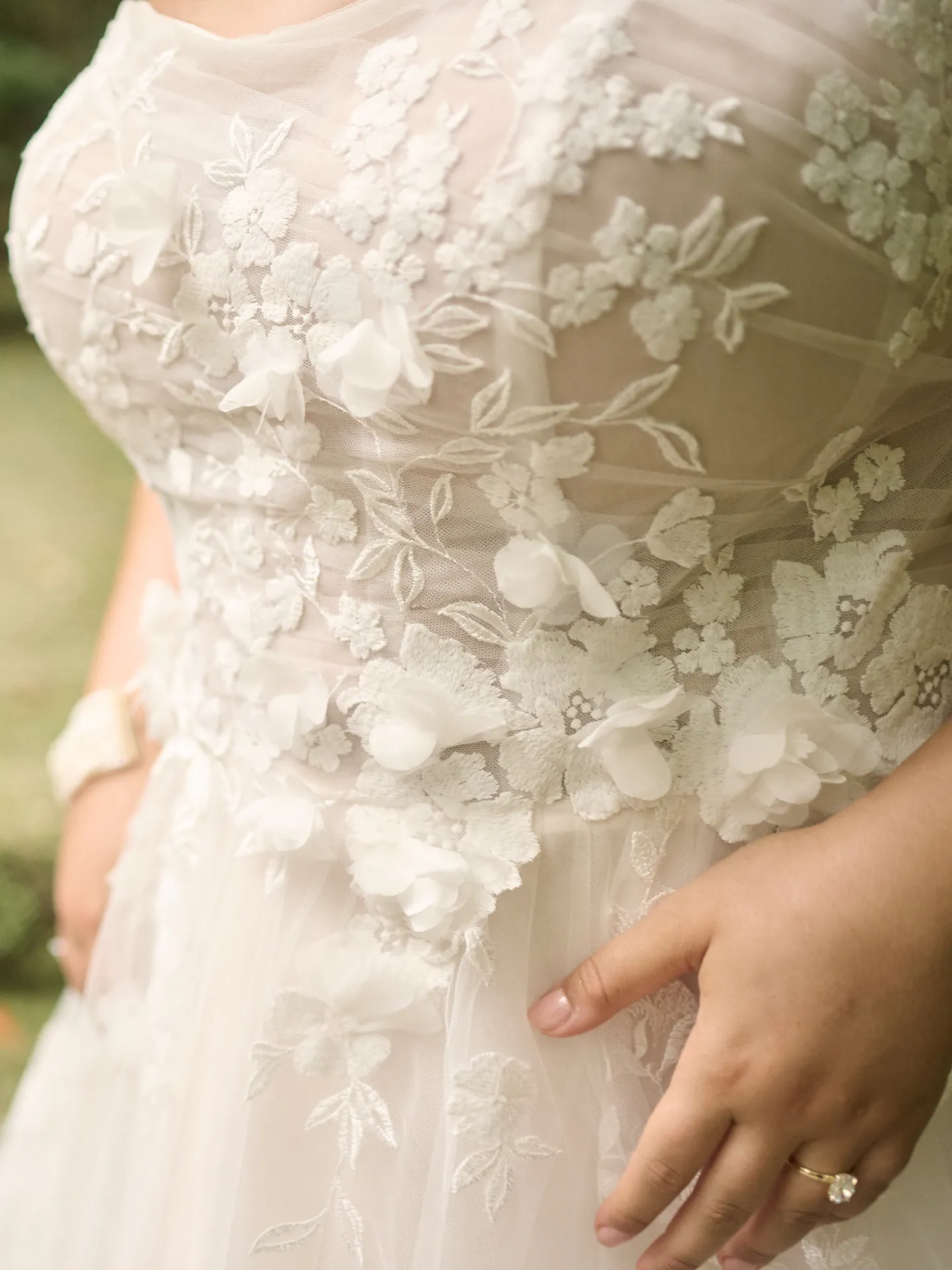 Maggie Sottero Laila 3D floral detail wedding gown close-up.