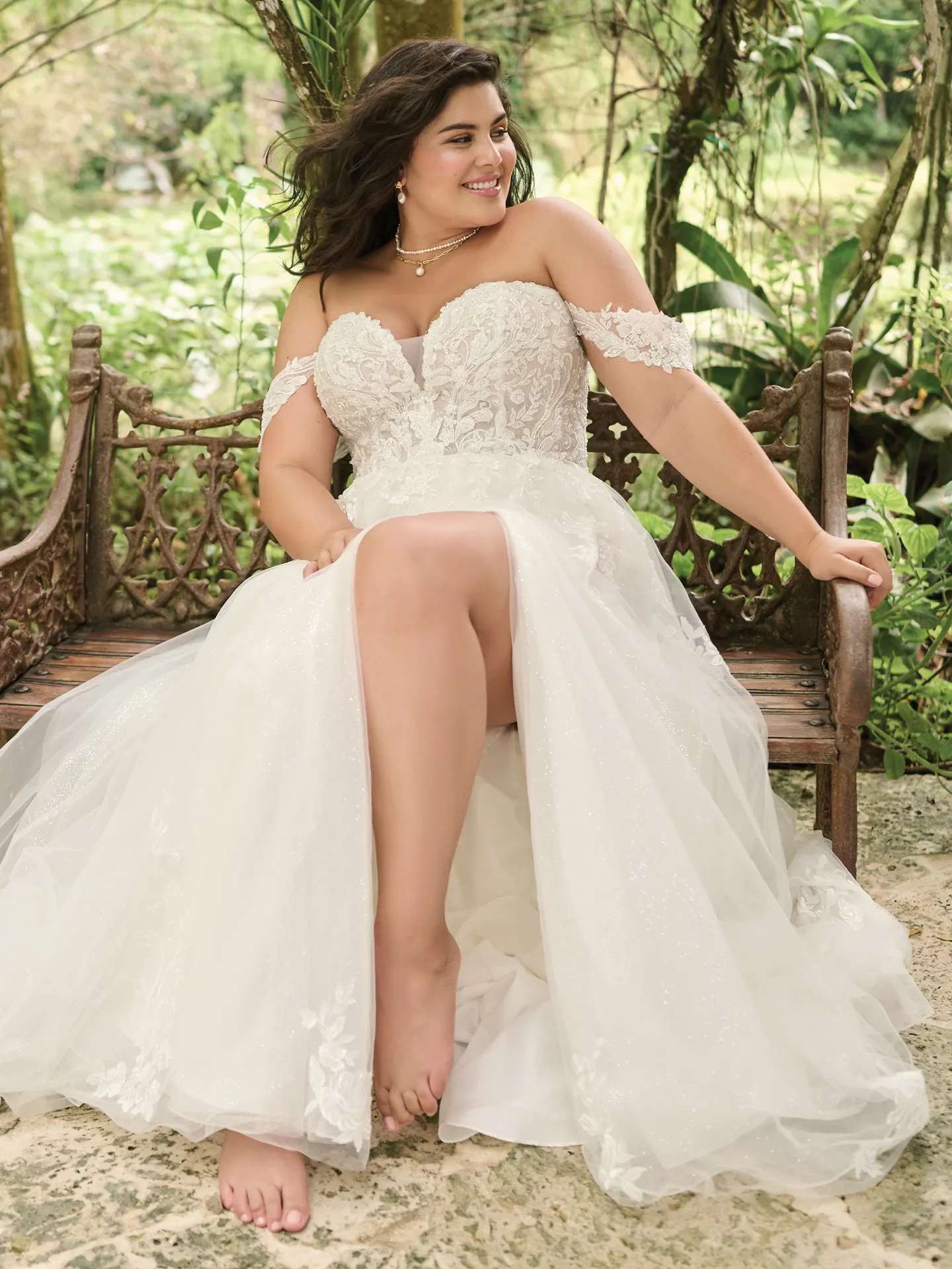 Maggie Sottero Marguerite A-Line gown front view with thigh-high slit, outdoor setting.