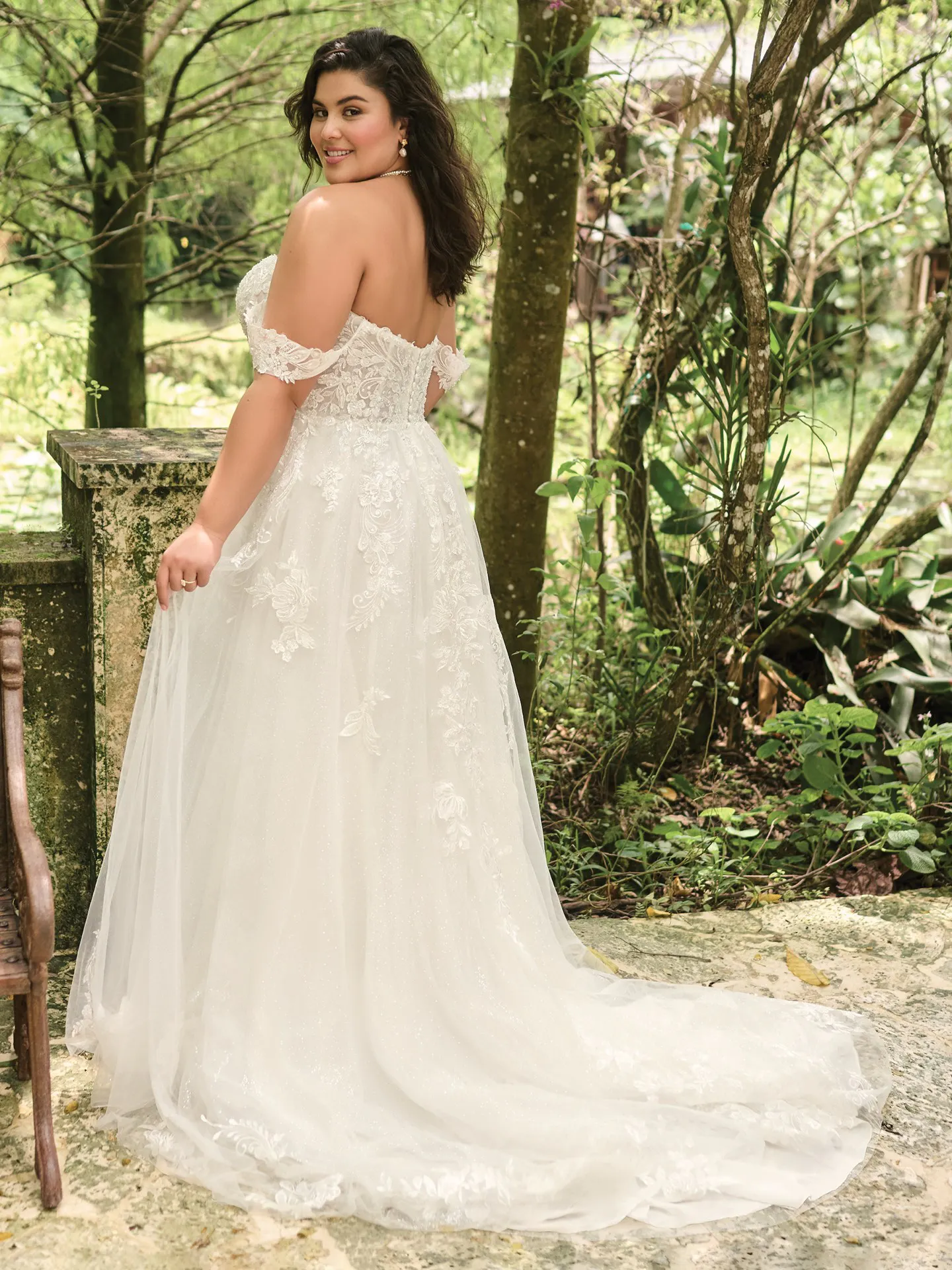 Maggie Sottero Marguerite back view A-Line bridal gown in garden setting