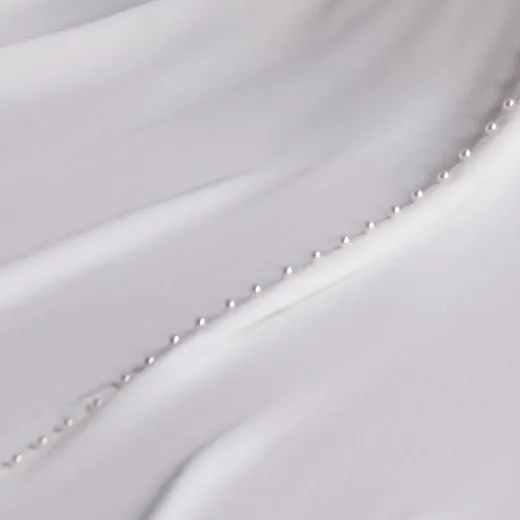 Pearl detail of Doritte wedding dress by Maggie Sottero.