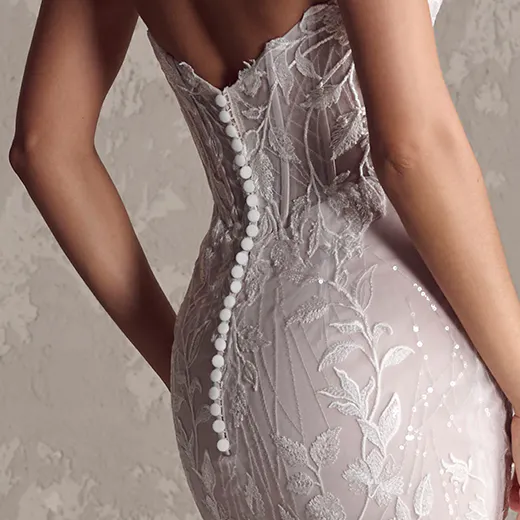 Maggie Sottero Fairchild back view, sequin lace bridal gown with button detail.