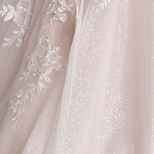 Maggie Sottero Marguerite detail view, floral lace and sparkling tulle fabric