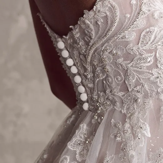 Maggie Sottero Marguerite lace detail with buttons on back.