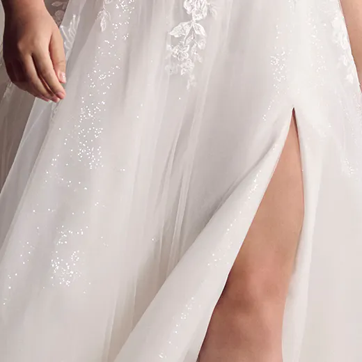 Maggie Sottero Marguerite close-up of A-line gown with thigh-high slit and floral lace.