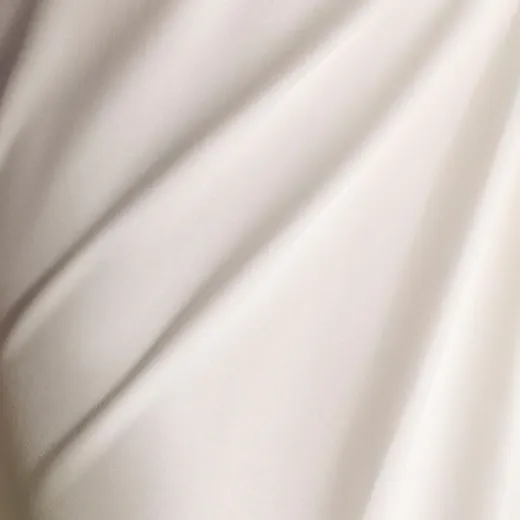Maggie Sottero Summer crepe wedding dress fabric close-up with recycled lining.
