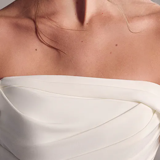 Crepe strapless neckline close-up, Maggie Sottero wedding dress