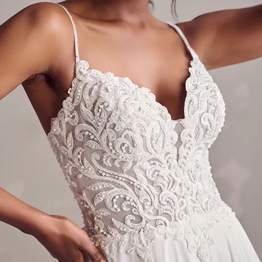 Rebecca Ingram Poppy close-up, lace detail bodice with thin straps.