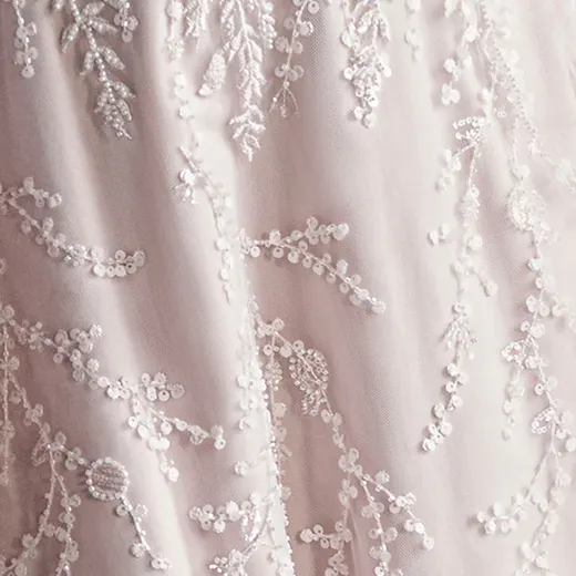 Rebecca Ingram Sonya fabric detail with intricate beaded floral lace pattern.