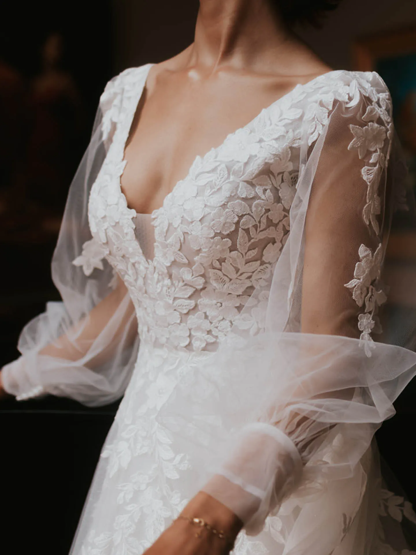 Maggie Sottero Alexandria dress with floral lace and bishop sleeves in a close-up view