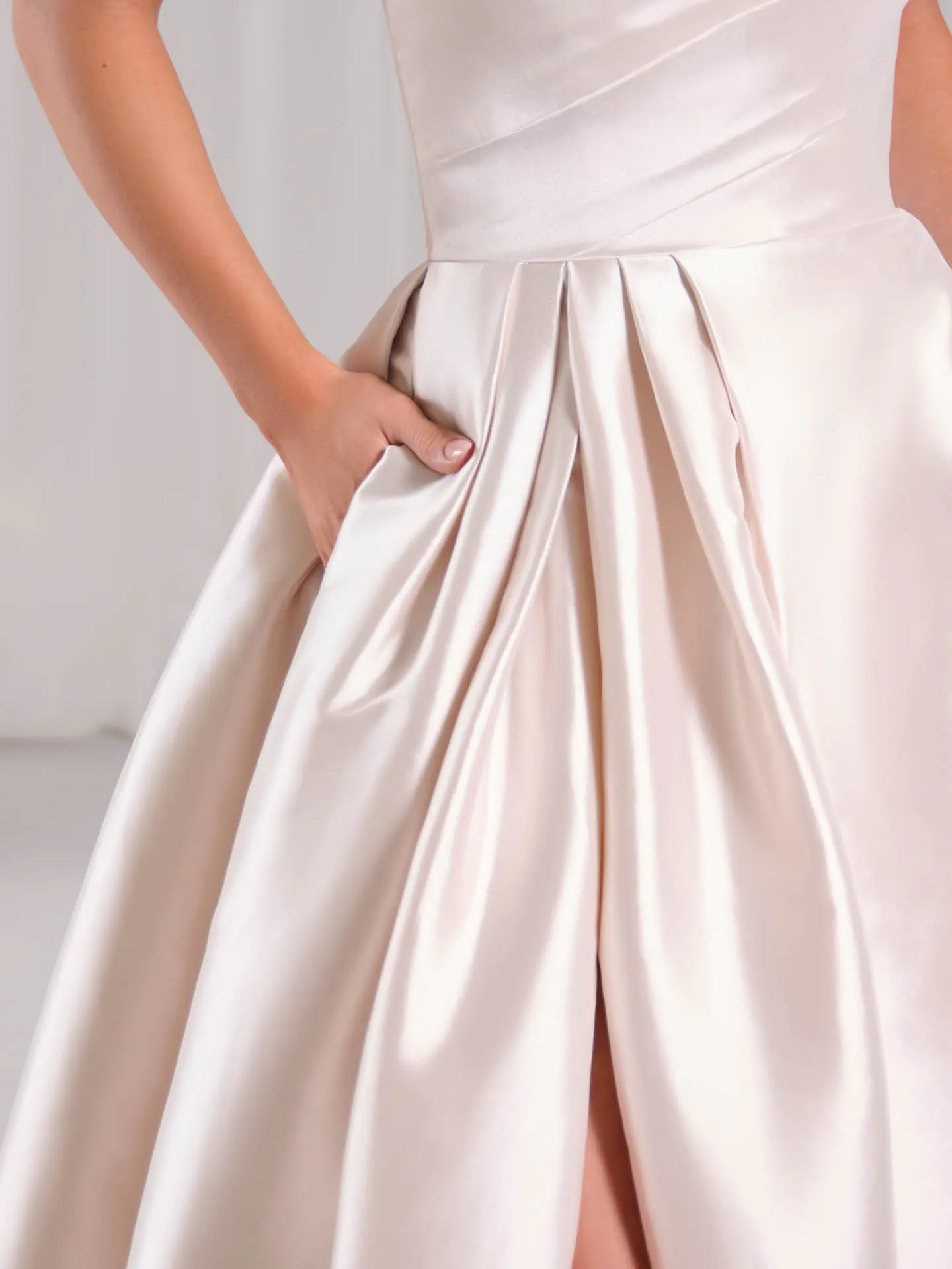 Sottero and Midgley Aspen dress close-up with pleated A-line skirt detail.
