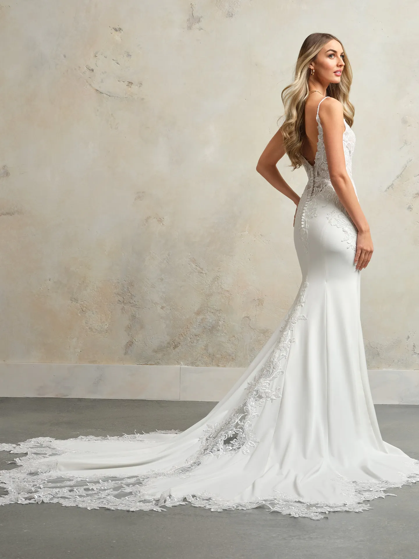 Maggie Sottero Anastasia back view, fitted bridal gown with lace train.