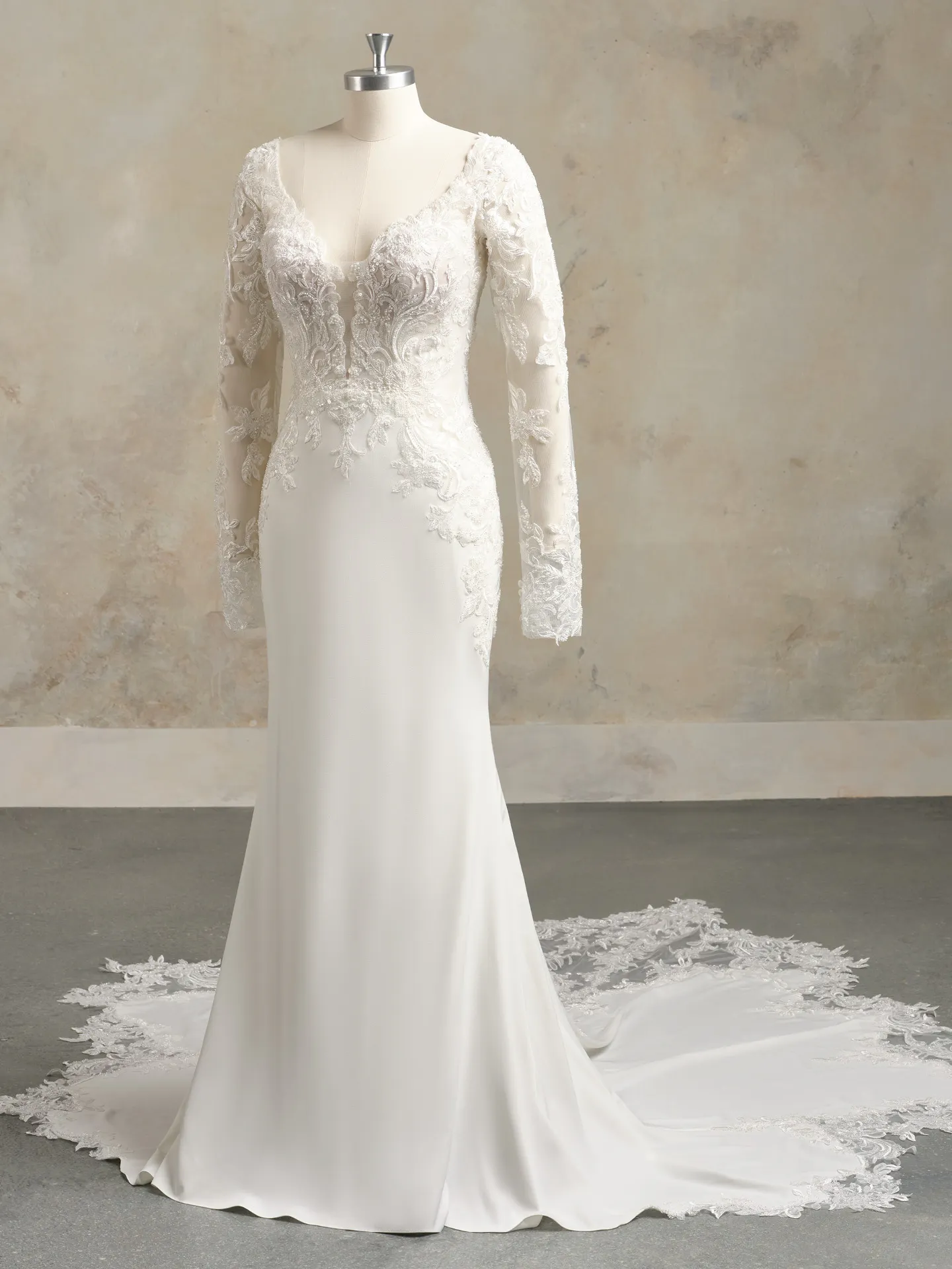 Maggie Sottero Anastasia front view bridal gown with lace sleeves and train.