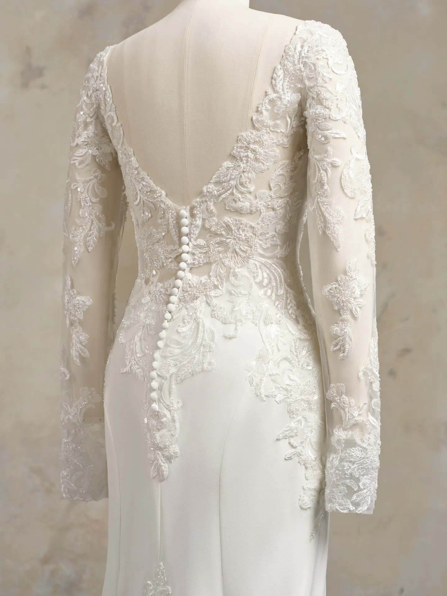 Maggie Sottero Anastasia back view with lace sleeves and button detail