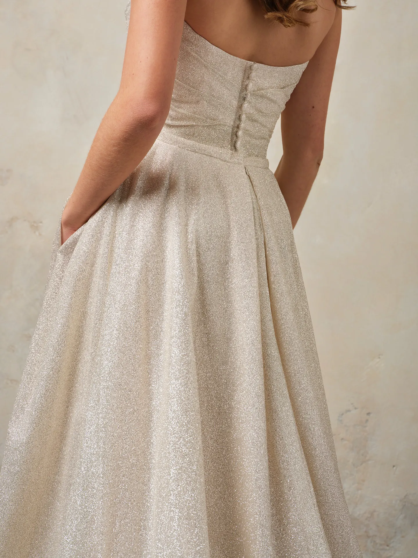 Maggie Sottero Anniston Lane glitter fit-and-flare gown back view