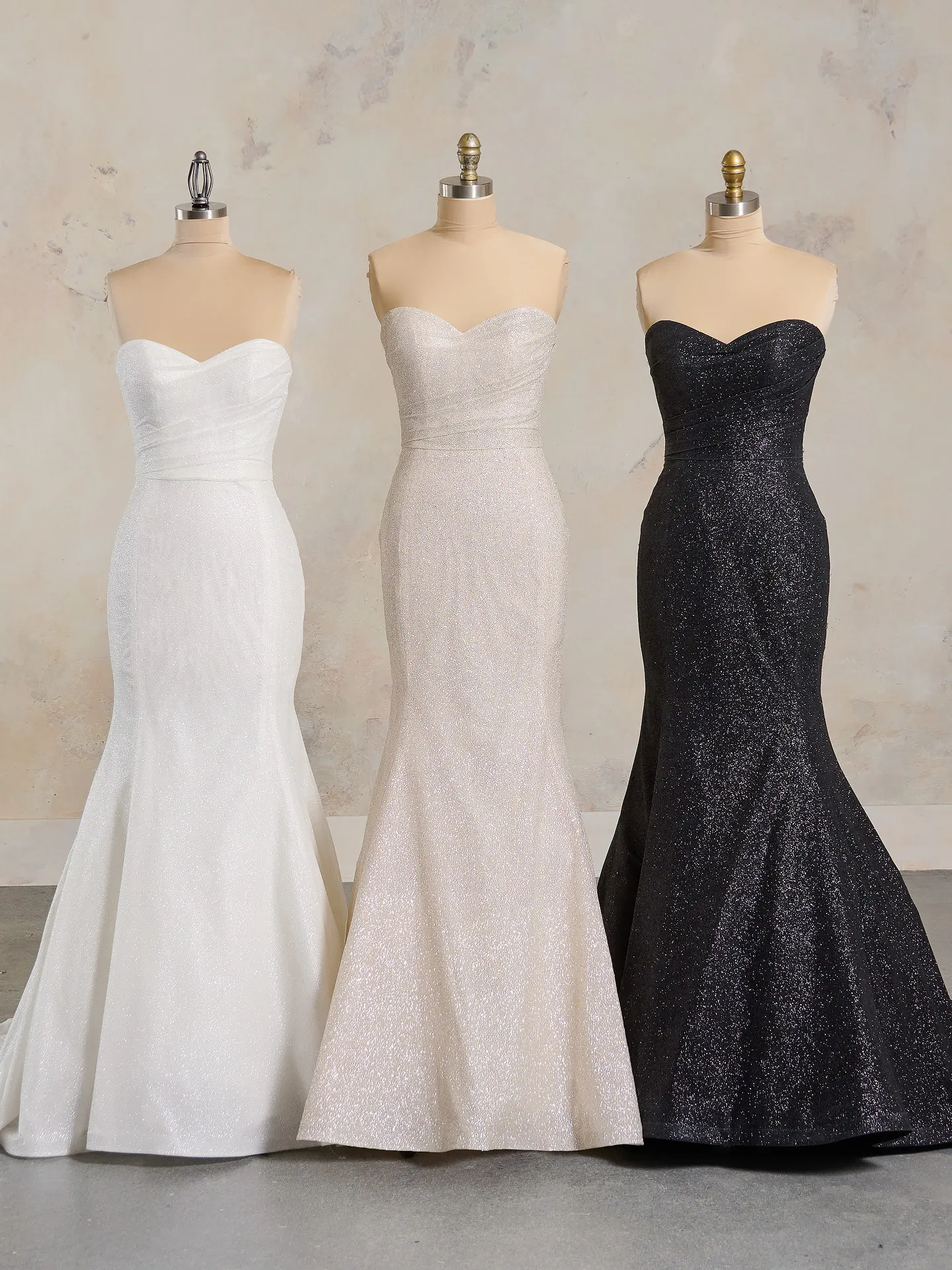 Anniston Lane fit-and-flare bridal gowns displayed on mannequins.