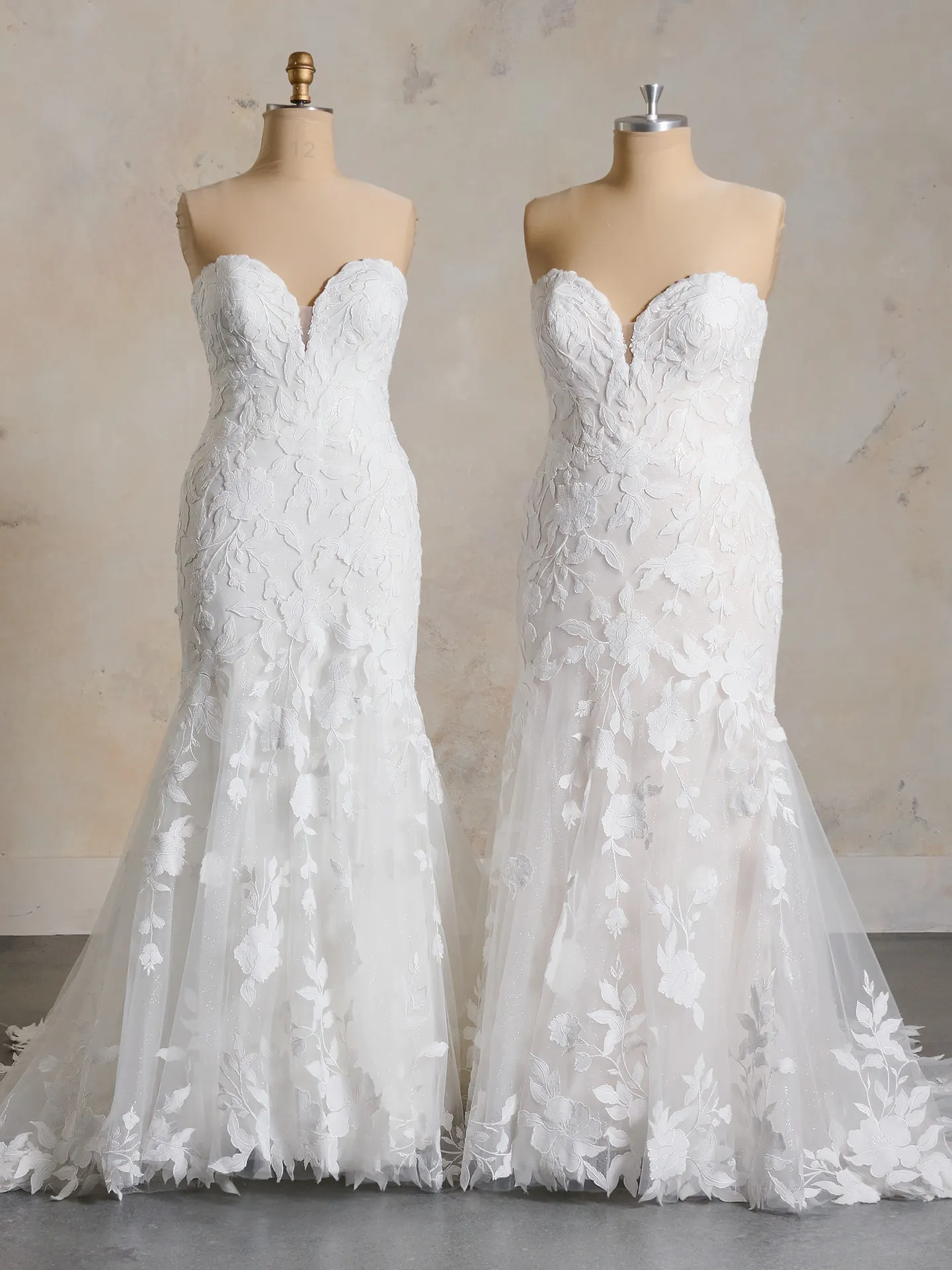 Maggie Sottero Bridget floral lace wedding dress front view on mannequins.