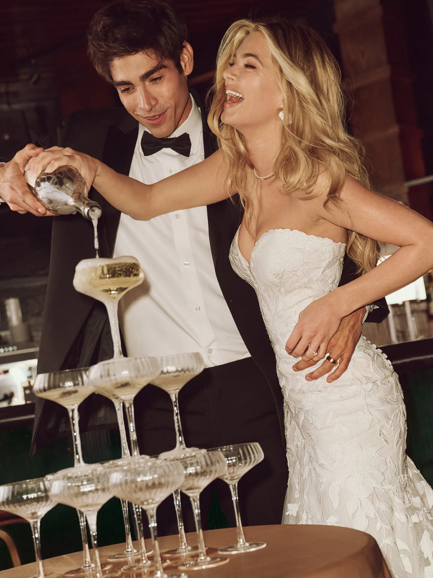 Maggie Sottero Bridget floral lace dress with man pouring champagne