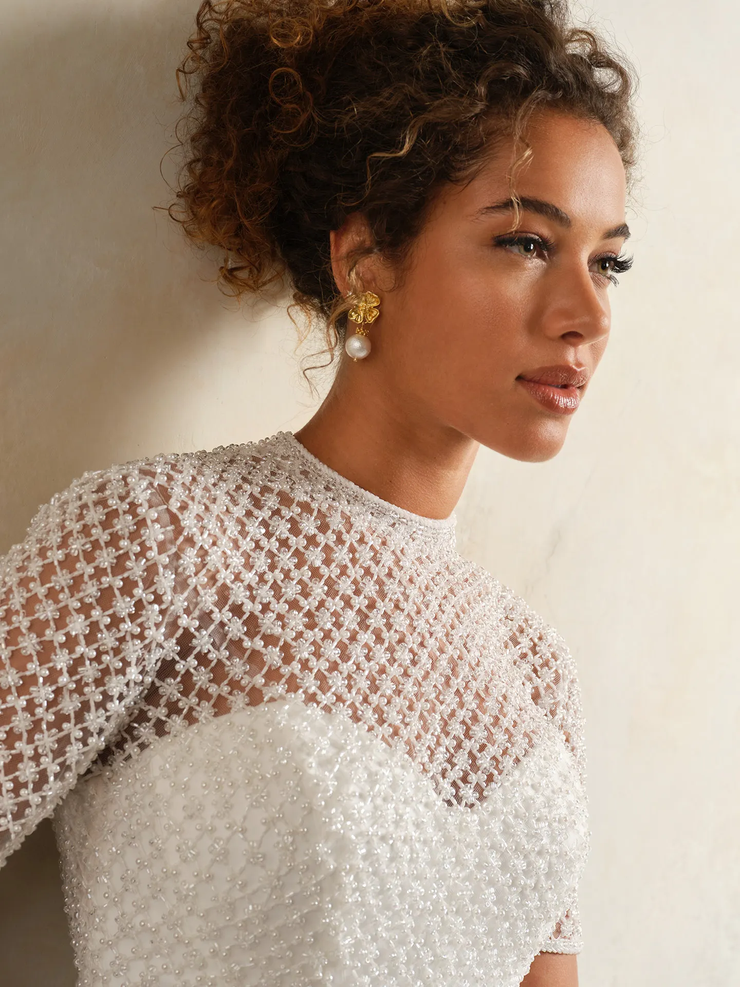 Maggie Sottero beaded illusion short sleeve top close-up.