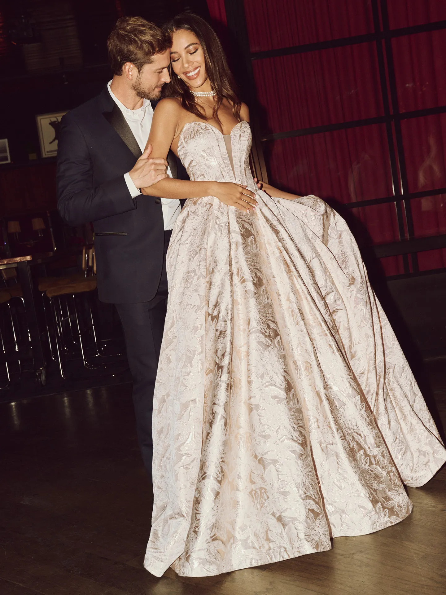 Rebecca Ingram floral ball gown front view in elegant setting.