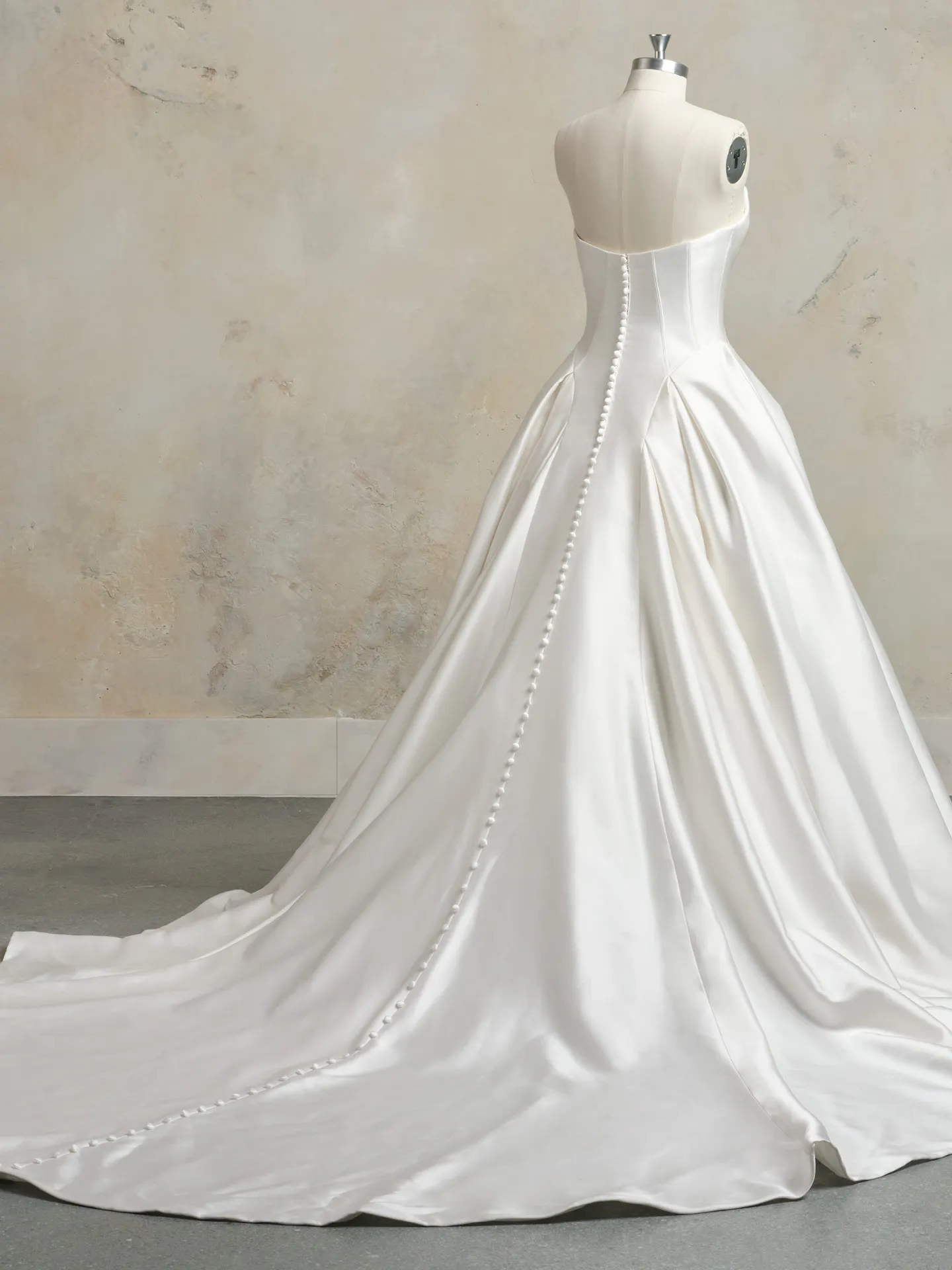 Fortune bridal dress back view with long train and button detail