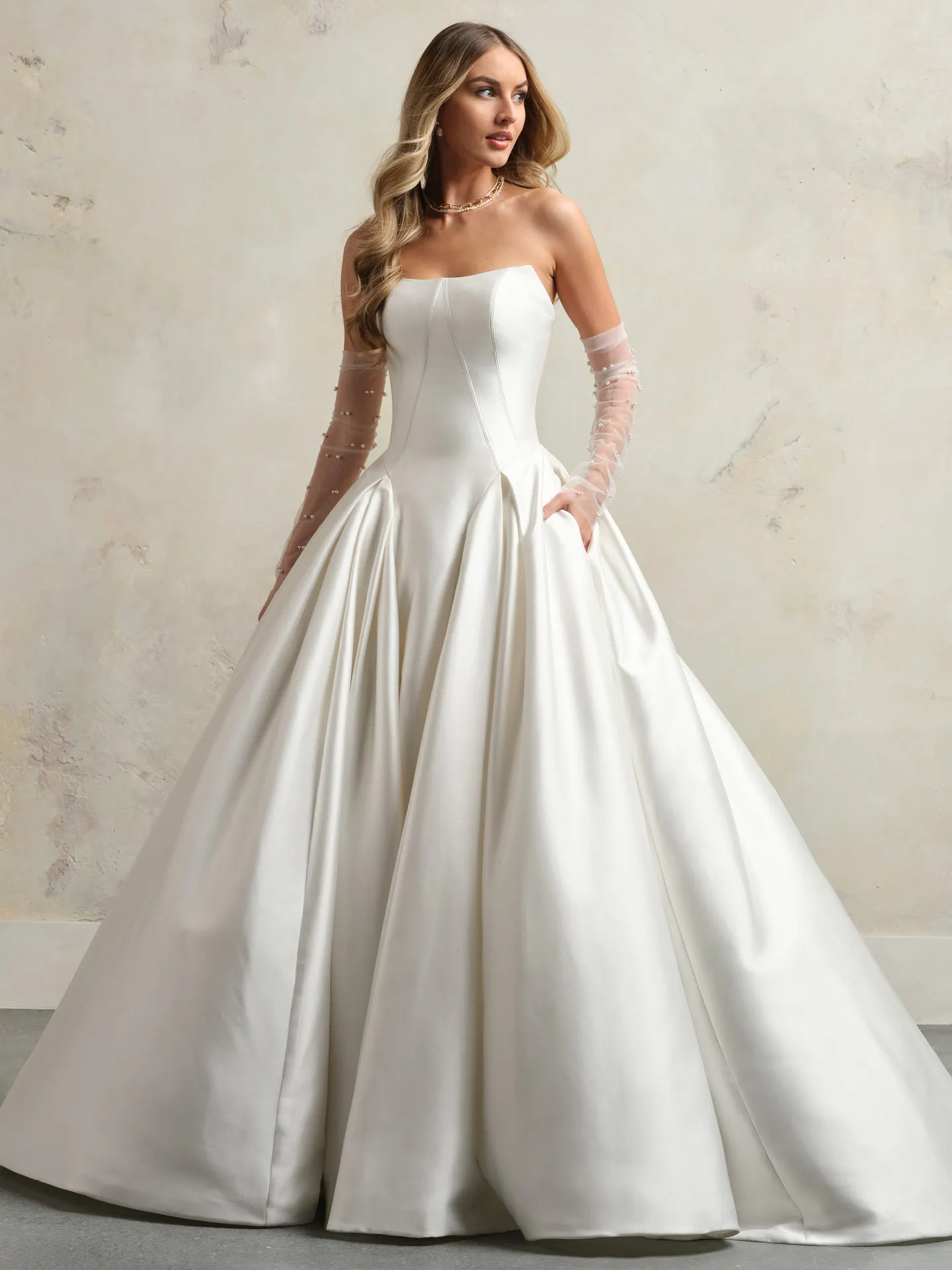 Maggie Sottero Fortune ballgown front view with sheer sleeves