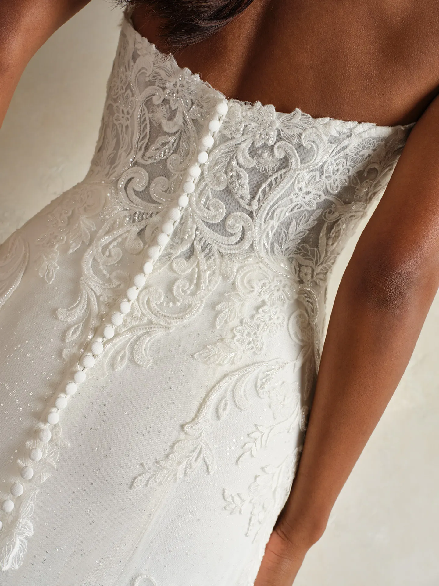Maggie Sottero Lavish Kyler back view ornate lace and buttons