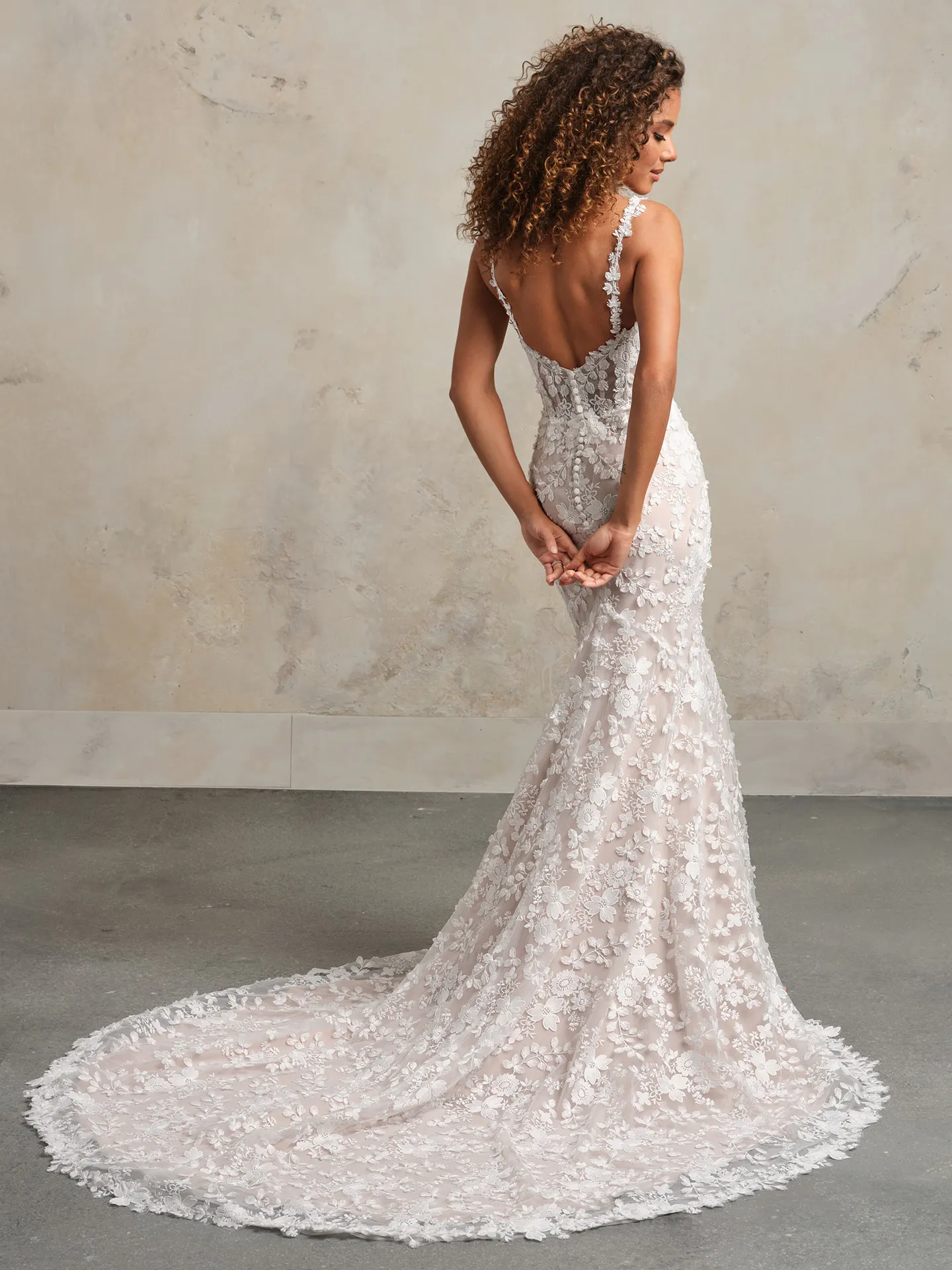Maggie Sottero Ladonna back view; 3D floral lace mermaid bridal gown.