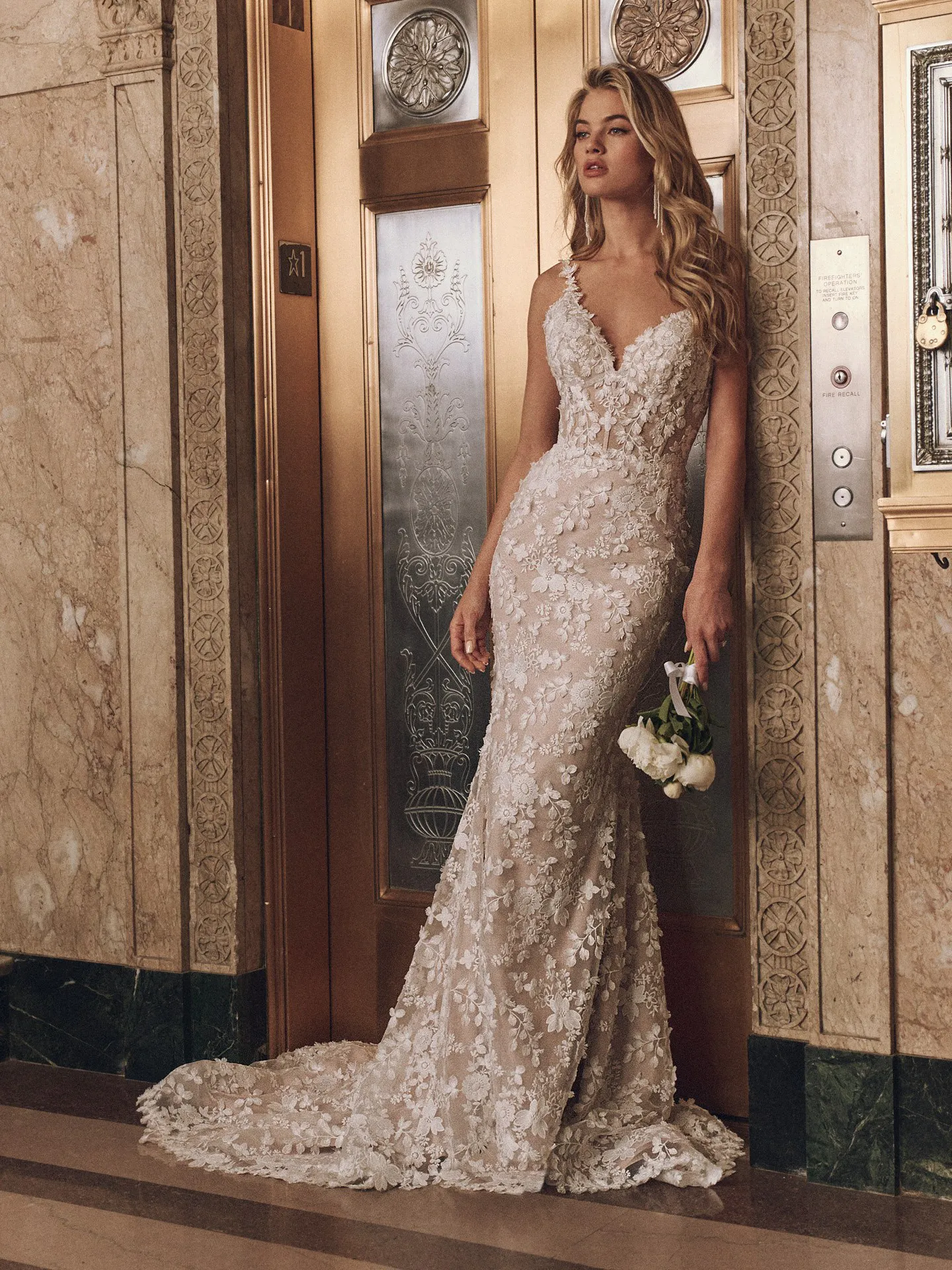 Maggie Sottero Ladonna Lane floral lace mermaid gown front view, ornate elevator background