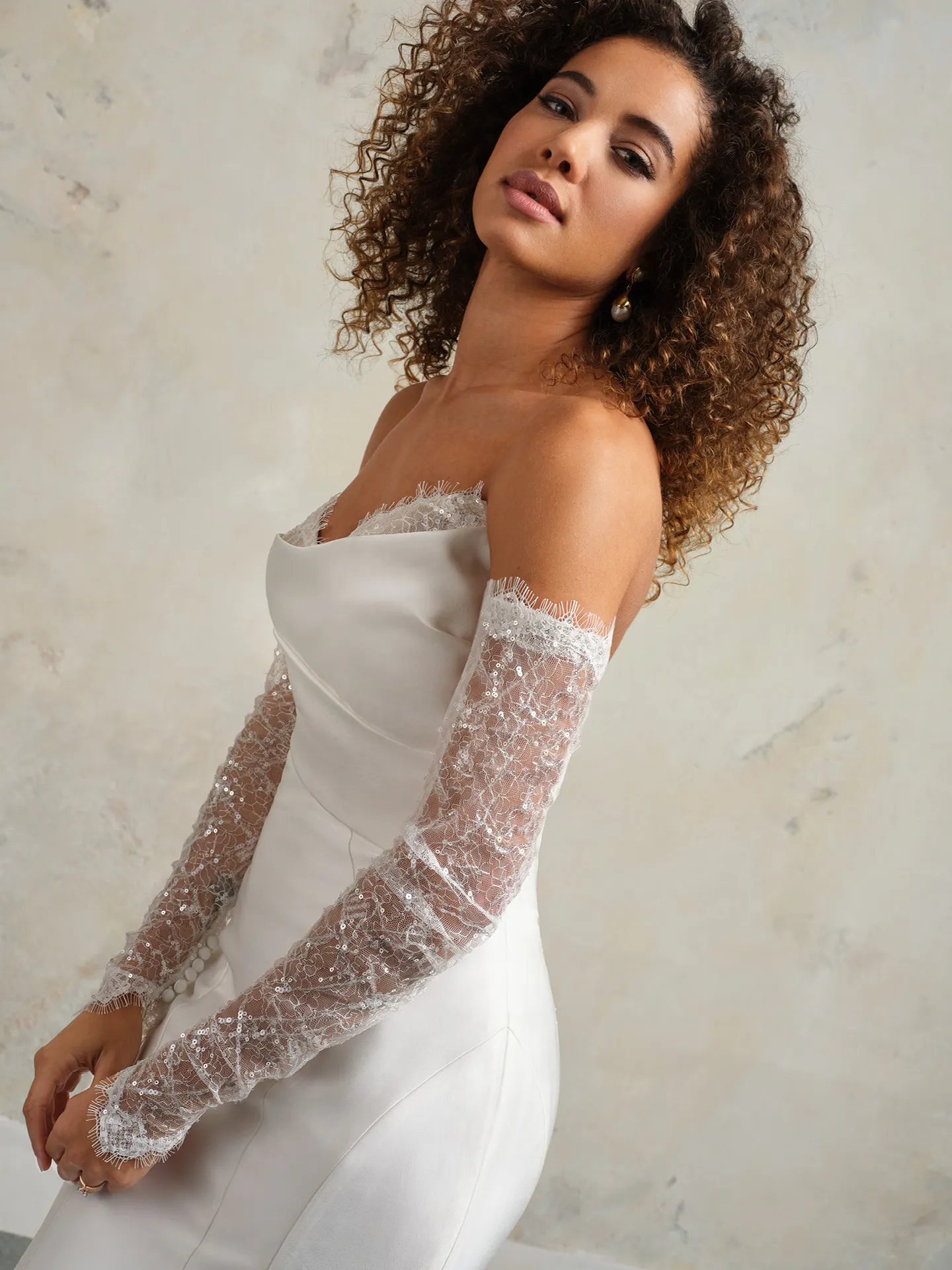 Leilani bridal dress, side view, sequined fit-and-flare with lace sleeves