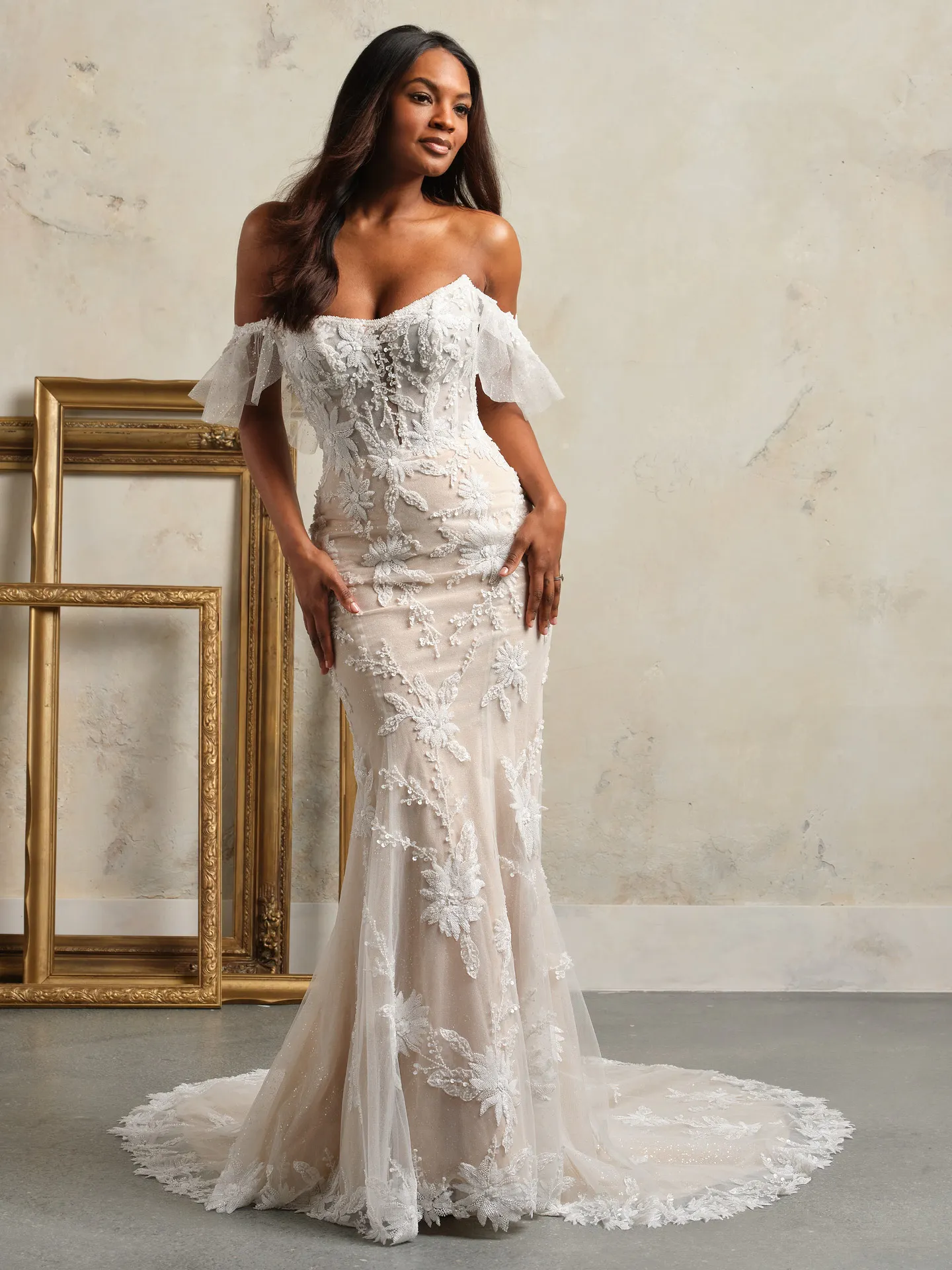 Rebecca Ingram sheer strapless lace corset wedding dress front view.