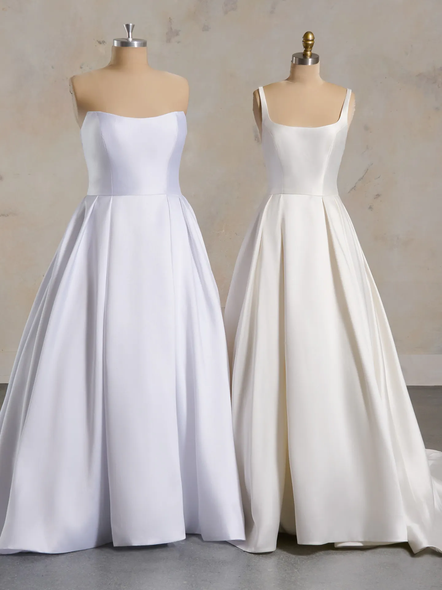 Maggie Sottero Selena satin A-line wedding dresses on display