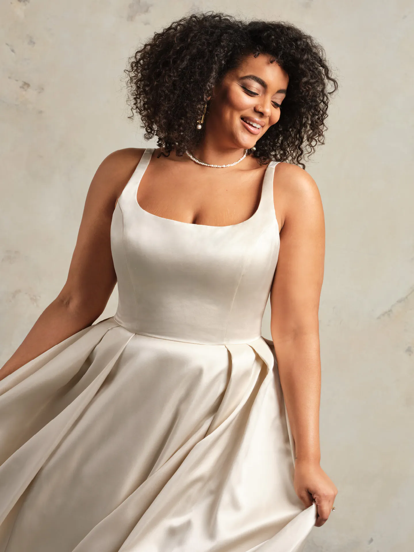 Maggie Sottero Selena satin gown with pockets front view